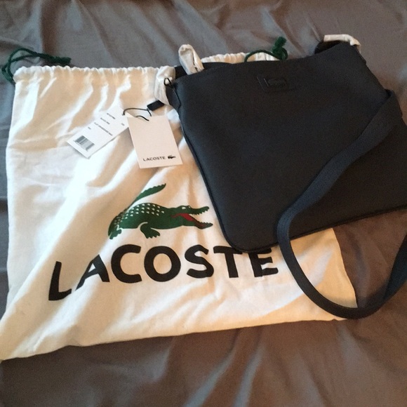 Lacoste Handbags - Lacoste blu/black flat crossover bag NWT